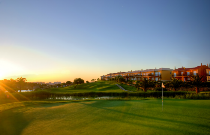 Green of Boavista golf course by the sunset