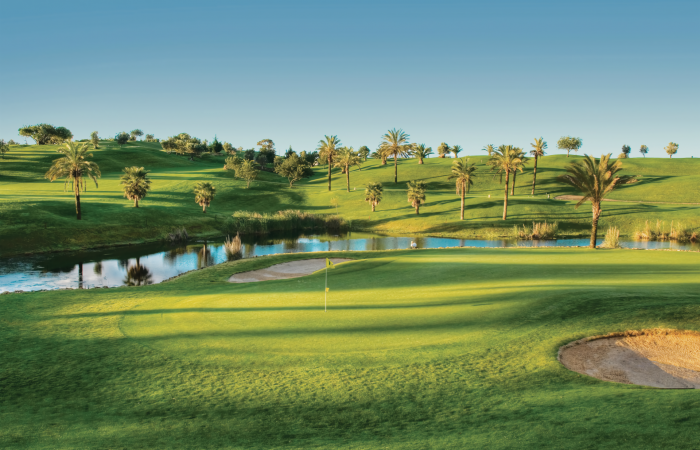 Gramacho Golf Course surrounded by water and palm trees